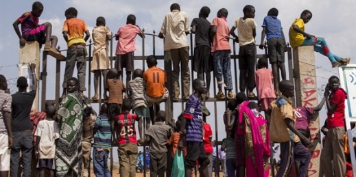 Internally displaced children are seen standing at the gate of their camp, Juba, South Sudan, Feb. 6, 2015 (U.N. photo by JC McIlwaine).