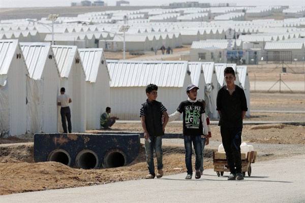 Boys take a walk at Azraq refugee camp in Azraq, Jordan, March 10, 2015 (AP photo by Raad Adayleh).