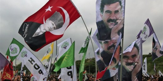 Supporters of the pro-Kurdish Peoples' Democratic Party wave flags with pictures of Mustafa Kemal Ataturk and imprisoned Kurdish rebel leader Abdullah Ocalan during a rally, Istanbul, Turkey, June 8, 2015 (AP photo by Lefteris Pitarakis).