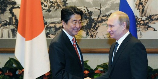 Russian President Vladimir Putin shakes hands with Japanese Prime Minister Shinzo Abe at the Asia-Pacific Economic Cooperation forum in Beijing, Nov. 9, 2014 (AP photo/RIA Novosti, Mikhail Klimentyev).