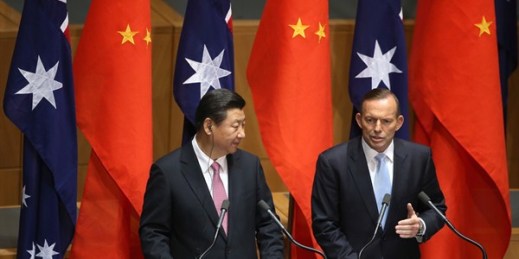 Chinese President Xi Jinping and Australian Prime Minister Tony Abbott speak at a press conference, Canberra, Nov. 17, 2014 (AP photo by Rick Rycroft).