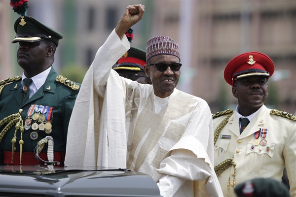 Nigerian President Muhammadu Buhari salutes his supporters during his inauguration, Abuja, Nigeria, May 29, 2015 (AP photo by Sunday Alamba).