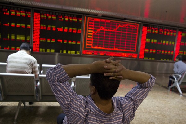Chinese investors monitor stock prices at a brokerage house, Beijing, China, July 9, 2015 (AP photo by Ng Han Guan).
