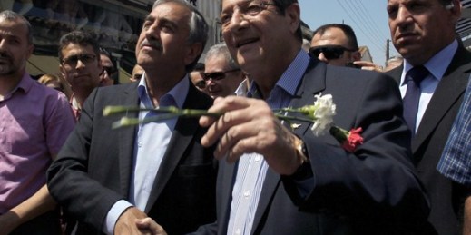 Republic of Cyprus President Nicos Anastasiades and northern Cyprus President Mustafa Akinci shake hands in the northern part of the divided capital Nicosia, Cyprus, May 23, 2015 (AP photo by Petros Karadjias).