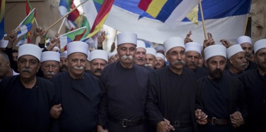 Members of Israel's Druze minority wave their flags during a march in support of Syria's Druze, Yarka, Israel, June 14, 2015 (AP photo by Ariel Schalit).