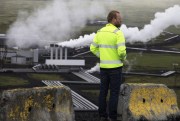 An employee surveys Reykjavik Energy's Hellisheidi geothermal power plant, Reykjavik, Iceland, July 28, 2011 (AP photo by Brennan Linsley).