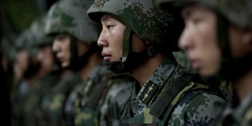 Soldiers of the Chinese People's Liberation Army 1st Amphibious Mechanized Infantry Division prepare for a demonstration, Beijing, China, July 12, 2011 (DoD photo by Mass Communication Specialist 1st Class Chad J. McNeeley).