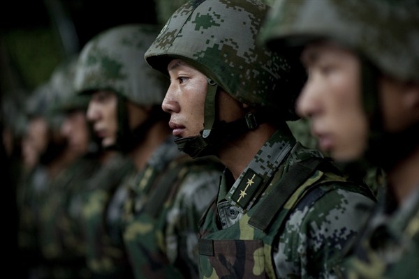 Soldiers of the Chinese People's Liberation Army 1st Amphibious Mechanized Infantry Division prepare for a demonstration, Beijing, China, July 12, 2011 (DoD photo by Mass Communication Specialist 1st Class Chad J. McNeeley).