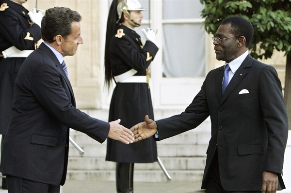 Then-French President Nicolas Sarkozy, left, shakes hand with Equatorial Guinean President Teodoro Obiang Ngeuma at the Elysee palace, Paris, Oct. 30, 2007 (AP photo by Jacques Brinon).