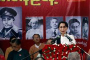Myanmar opposition leader Aung San Suu Kyi speaks during a ceremony to mark the 68th anniversary of Martyrs' Day at the headquarters of her National League for Democracy Party, Yangon, Myanmar, July 19, 2015 (AP photo by Khin Maung Win).