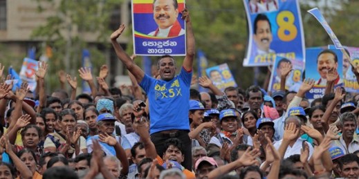 Supporters of former Sri Lankan president and parliamentary candidate Mahinda Rajapaksa cheer for him during an election campaign rally, Anuradhapura, Sri Lanka, July 17, 2015 (AP photo by Eranga Jayawardena).