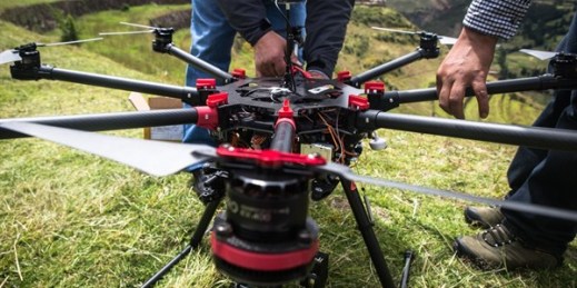 Researchers ready a DJI S1000 octocopter drone for a mapping project, Sacred Valley, Peru, March 2015 (Photo by Faine Greenwood).