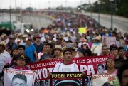 Relatives of the 43 missing Ayotzinapa teachers' college students lead a march marking the one-year anniversary of the students' disappearances, Chilpancingo, Mexico, Sept. 26, 2015 (AP photo by Rebecca Blackwell).