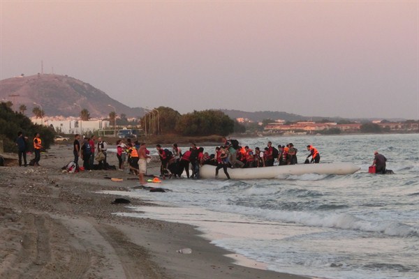 A rubber boat carrying around 50 migrants and refugees arrives from Bodrum in Turkey to the Greek island of Kos, Sept. 2, 2015 (International Federation of the Red Cross and Red Crescent photo by Christopher Jahn).