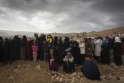 A long line of women refugees from Syria wait to register with UNHCR, Arsal, Lebanon, Nov. 2013 (UNHCR photo).