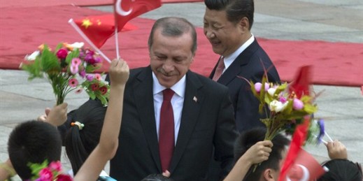 Turkish President Recep Tayyip Erdogan and Chinese President Xi Jinping are greeted by Chinese children during a welcome ceremony at the Great Hall of the People in Beijing, China, July 29, 2015 (AP photo by Ng Han Guan).