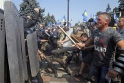 Ukrainian protesters clash with police after a vote to give greater powers to the east, outside the Parliament, Kiev, Ukraine, Aug. 31, 2015 (AP photo by Efrem Lukatsky).