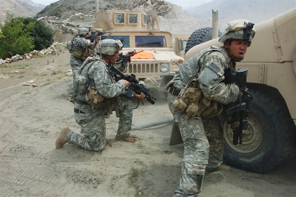 U.S. soldiers engage Taliban forces during a halt to repair a disabled vehicle near the village of Allah Say, Afghanistan, Aug. 20, 2007 (DoD photo by Staff Sgt. Michael L. Casteel).