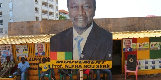 A billboard with the face of Guinea’s incumbent president, Alpha Conde, in Conakry, Guinea, Oct. 9, 2015 (AP Photo by Youssouf Bah).