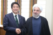 Japanese Prime Minister Shinzo Abe shakes hands with Iranian President Hassan Rouhani at the U.N. Headquarters, New York, Sept. 27, 2015 (Photo by the Yomiuri Shimbun via AP Images).