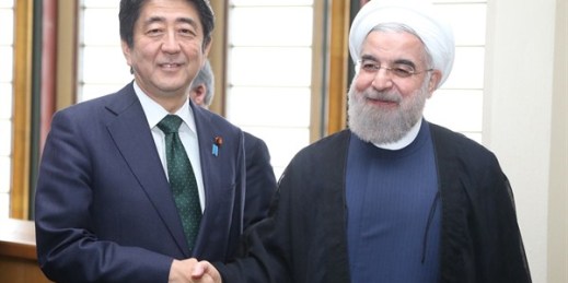 Japanese Prime Minister Shinzo Abe shakes hands with Iranian President Hassan Rouhani at the U.N. Headquarters, New York, Sept. 27, 2015 (Photo by the Yomiuri Shimbun via AP Images).