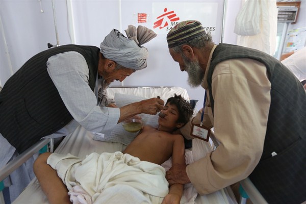An Afghan boy is fed as he recovers at a Medecins Sans Frontieres (MSF) hospital in Kunduz province, north of Kabul, Afghanistan, May 20, 2015 (AP photo by Rahmat Gul).