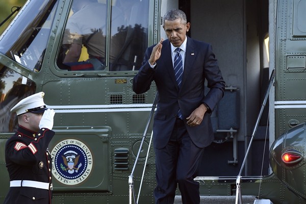 U.S. President Barack Obama walks off of Marine One after returning from a trip to West Virginia, the White House, Washington, Oct. 21, 2015 (AP photo by Susan Walsh).