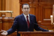 Romanian Prime Minister Victor Ponta gestures during a special parliament session, Bucharest, Romania, Sept. 29, 2015, before facing a no-confidence vote (AP photo by Octav Ganea).