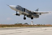 A Russian SU-24M jet fighter takes off from an airbase Hmeimim, Syria, photo taken from the Russian Defense Ministry official web site Tuesday, Oct. 6, 2015 (Russian Defense Ministry photo).