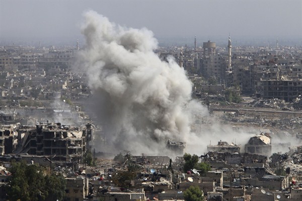 Smoke rises after shelling by Syrian army backed by Russia airstrikes, Damascus, Syria, Oct. 14, 2015 (Alexander Kots/Komsomolskaya Pravda via AP).