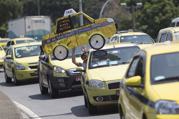 Taxi drivers protest the Uber ride service, Rio de Janeiro, Brazil, Nov. 11, 2015 (AP photo by Leo Correa).
