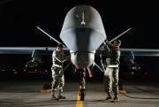 Airmen prepare a MQ-9 Reaper during an exercise at Creech Air Force Base, Nev., May 15, 2014 (U.S. Air Force photo by Staff Sgt. Nadine Barclay).
