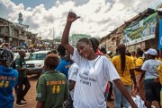 A woman celebrates in Freetown as Sierra Leone is declared Ebola-free, Nov. 7, 2015 (AP photo by Aurelie Marrier d'Unienvil).