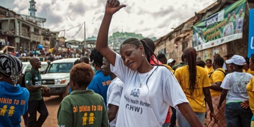 A woman celebrates in Freetown as Sierra Leone is declared Ebola-free, Nov. 7, 2015 (AP photo by Aurelie Marrier d'Unienvil).
