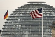 The U.S. flag flies on top of the U.S. embassy in front of the German Bundestag, Berlin, Oct. 25, 2013 (AP photo by Michael Sohn).