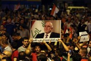 Demonstrators chant in support of Iraqi Prime Minister Haider al-Abadi, Baghdad, Iraq, Aug. 9, 2015 (AP photo by Khalid Mohammed).