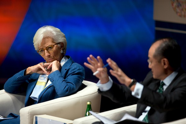 International Monetary Find Managing Director Christine Lagarde listens as World Bank President Jim Yong Kim addresses a forum in Lima, Peru, Oct. 7, 2015 (AP photo by Rodrigo Abd).