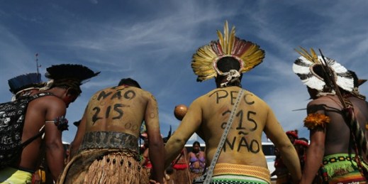 Brazilian Pataxo men protest against a proposed constitutional amendment that would threaten their land rights, Brasilia, Brazil, Nov. 10, 2015 (AP photo by Eraldo Peres).
