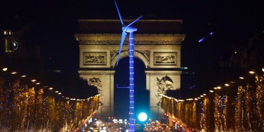 A power-generating windmill turbine on the Champs Elysees avenue as part of the COP21, United Nations Climate Change Conference, Paris, France, Dec. 2, 2015 (AP photo by Francois Mori).