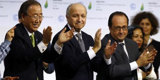French President Francois Hollande, French Foreign Minister Laurent Fabius and United Nations Secretary-General Ban Ki-moon at the the United Nations conference on climate change, Le Bourget, France, Dec. 12, 2015 (AP photo by Francois Mori).