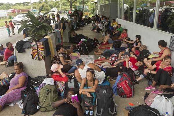 Cuban migrants outside the Costa Rican immigration building at the border with Nicaragua, Penas Blancas, Costa Rica, Nov. 16, 2015 (AP photo by Esteban Felix).