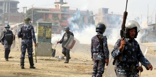 Nepalese policemen disperse ethnic Madhesi protesters in Gaur, on the Indian border, Nepal, Dec. 20, 2015 (AP photo by Gautham Shreshta).