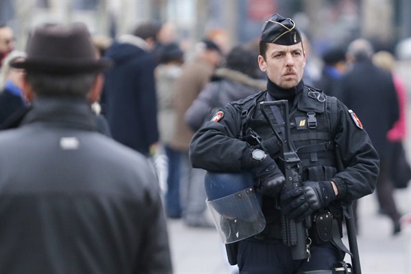 A riot police officer patrols the Place de la Republique, Paris, Nov. 27, 2015 (AP photo by Jacques Brinon).