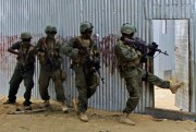Masked Somali National Army soldiers search through homes for al-Shabaab fighters, Ealsha Biyaha, Somalia, June, 2, 2012 (AP photo by Farah Abdi Warsameh).