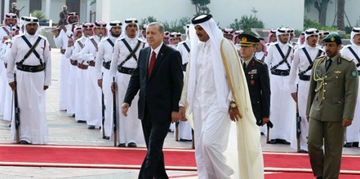 Turkish President Recep Tayyip Erdogan and Qatari Emir Tamim bin Hamad Al Thani during a ceremony, Doha, Qatar, Dec. 2, 2015 (AP/Presidential Press Service photo by Yasin Bulbul).
