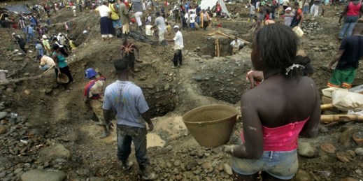 People pan for gold along the Dagua River, Zaragoza, Colombia, July 8, 2009 (AP photo by Christian Escobar Mora).