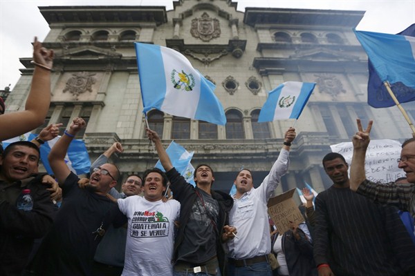 Demonstrators celebrate the withdrawal of President Otto Perez Molina's immunity from prosecution, Guatemala City, Sep. 1, 2015 (AP photo by Moises Castillo).