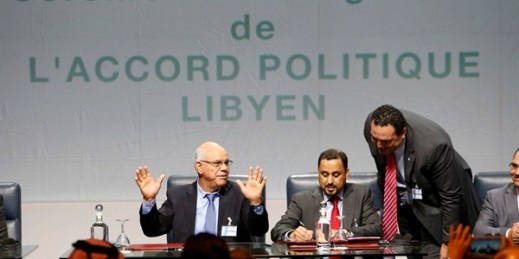 The signing of a U.N.-sponsored deal forming a unity government and aiming to end Libya's conflict, Dec. 17, 2015, Sikhrat, Morocco (AP photo by Abdeljalil Bounhar).