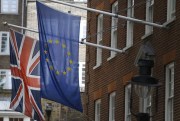 The U.K. flag and the EU flag outside the European Commission Representation, London, June 9, 2015 (AP photo by Kirsty Wigglesworth).