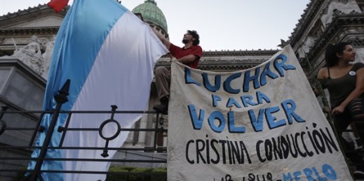 A sign that reads in Spanish "fight to return Cristina's leadership" during a protest against President Mauricio Macri's economic measures, Buenos Aires, Argentina, Dec. 17, 2015 (AP photo by Victor R. Caivano).